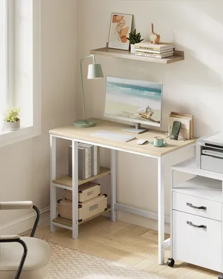 A clean and organized home office setup with a desk, computer, and shelves.