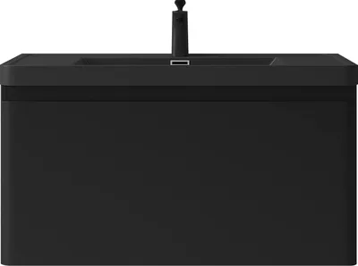 A black bathroom vanity with a sink and faucet.