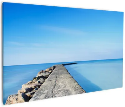 Produktbild von Wallario Premium Leinwandbild Pier am blauen Ozean mit blauem Himmel in Größe 60 x 90 cm
