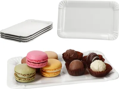 A collage of white paper plates and chocolates and macarons on a plate.