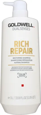A white bottle of Goldwell Dualsenses Rich Repair Restoring Shampoo with a pump dispenser.