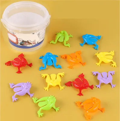 Produktbild von 12PCS Bunte Frösche Springen Spielzeug Finger Drücken Springende Frösche mit Eimer Kinder Hüpfende Spielzeug Set Transparent