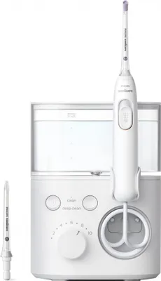 A white Philips Power Flosser 3000 with its water tank and handle shown against a white background. A spare nozzle is visible to the left of the main unit.