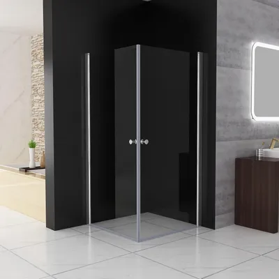A modern bathroom with a glass shower enclosure.