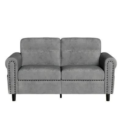 A studio shot of a gray sofa against a white background.