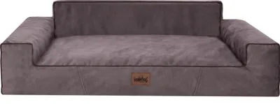 A dog bed with raised sides and a cushioned base, presented on a white background.