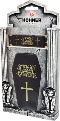 A Hohner Ozzy Osbourne Signature Harp harmonica in its coffin-shaped packaging, with gargoyle figures on the sides.