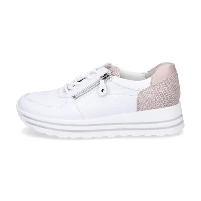 A studio shot of a single white sneaker against a white background.
