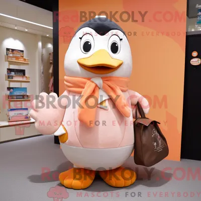 Produktbild von Maskottchen-Charakter REDBROKOLY eines Pfirsich-Pinguins mit Mantel und Tragetaschen