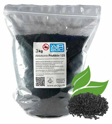 A bag of charcoal pellets with green leaf graphics.