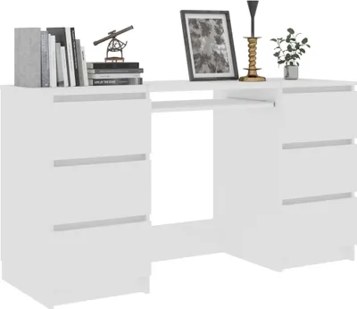 A white desk with drawers, decorated with a picture frame, candle holder, and a plant.