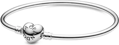 A silver Pandora bracelet with a heart-shaped clasp is shown against a white background.
