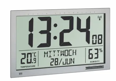 A digital clock displaying time, date, temperature, and humidity.