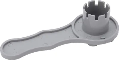 A gray plastic tool for inflating or deflating valves.