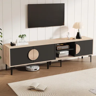 A modern living room scene featuring a TV stand with a television mounted above it.