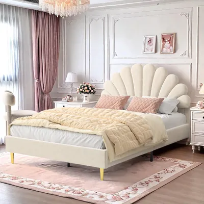 A bedroom with a bed, nightstands, and curtains.