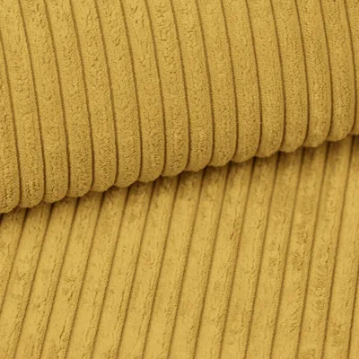 A close-up view of yellow corduroy fabric.