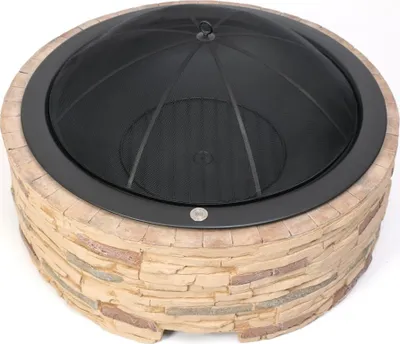 A round fire pit with a stone-like exterior and a black mesh cover.