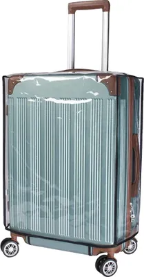 A transparent protective cover is placed over a green suitcase with silver trim and brown accents.