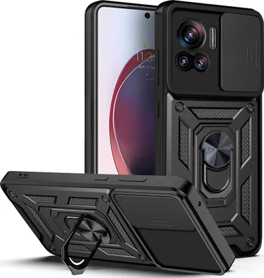 A black phone case with a ring stand and camera cover is displayed diagonally, with a phone partially visible behind it.