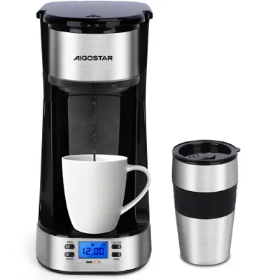 A coffee maker with a mug and a travel mug.