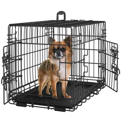 A small dog is inside a black wire dog crate.