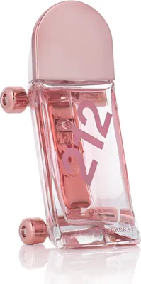 A pink perfume bottle with the number 212 on it, standing on a white surface.