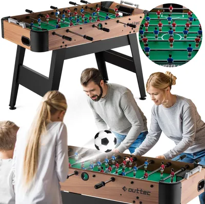 A family playing foosball.