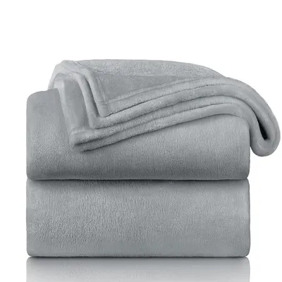 Two folded gray fleece blankets are stacked on top of each other against a white background.