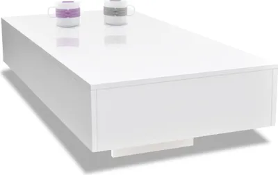 A white high-gloss coffee table with two decorative mugs on top.
