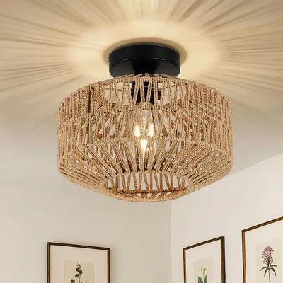 A close-up shot of a ceiling light fixture with a woven shade, mounted on a white ceiling.