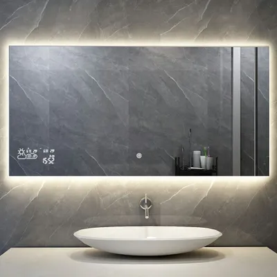 A modern bathroom with a smart mirror above a sink.