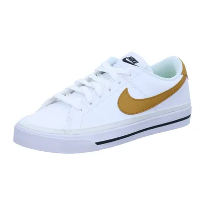 A white Nike Court Legacy sneaker with a gold swoosh.