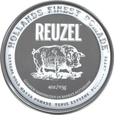 A close-up of the lid of a Reuzel pomade tin, featuring the brand logo, a drawing of a pig, and product details.