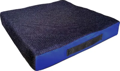 A dark blue and black seat cushion with a velcro strap on the side, isolated on a white background.