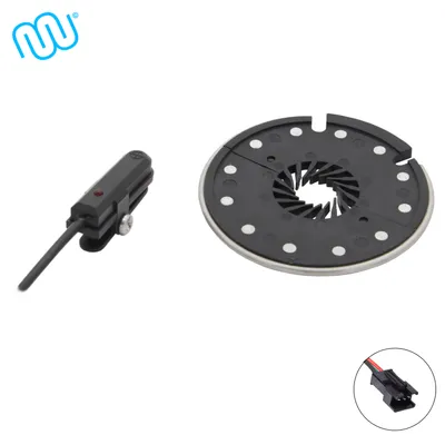A product image displaying two electronic components for a bicycle, with a logo in the top left corner and a close-up of a connector in the bottom right corner.