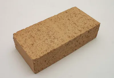 A single brick on a plain white background.