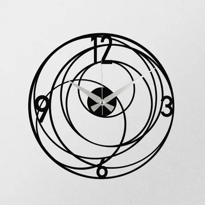A black metal wall clock with a swirling, abstract design and silver hands, mounted on a white wall.