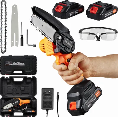 A hand holding a mini chainsaw kit, with accessories and batteries displayed around it.