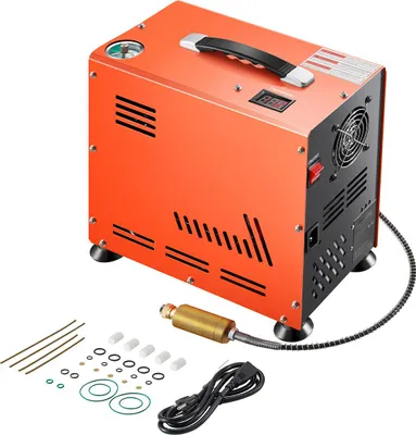 An orange PCP air compressor with accessories on a white background.