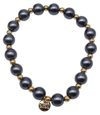 Imagen del producto de Pulsera elástica de color gris antracita con detalles dorados, disponible en 2 tamaños: 7 mm