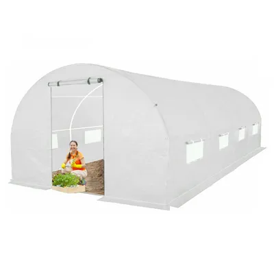 A woman is gardening inside a white greenhouse.