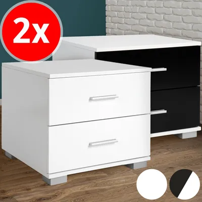 Two bedside tables, one white and one black, are shown in a room setting with a brick wall in the background.