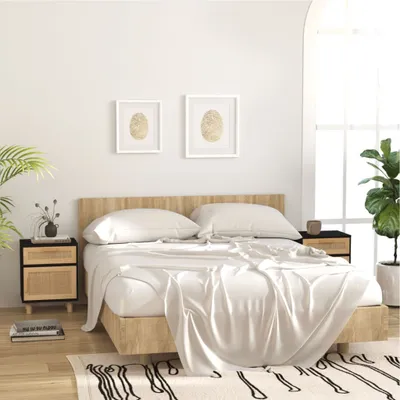A bedroom scene with a bed, nightstands, and plants.