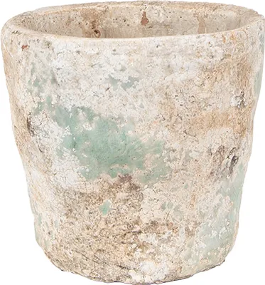 A close-up studio shot of a textured, weathered terracotta pot with green and beige accents.