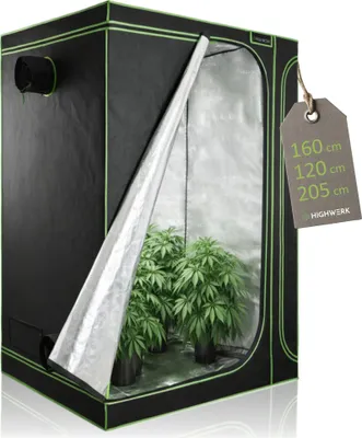 A grow tent with plants inside, shown with a tag attached.