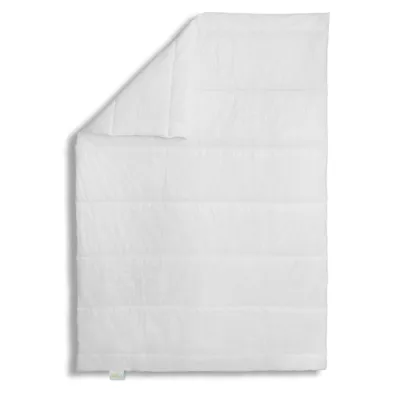 A white duvet is folded and laid flat on a white background.