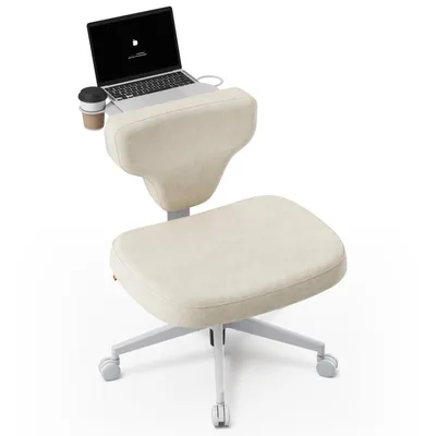 A beige ergonomic chair with a laptop and a coffee cup on a white background.
