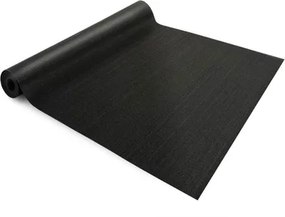 A black rubber mat is unrolled on a white background.