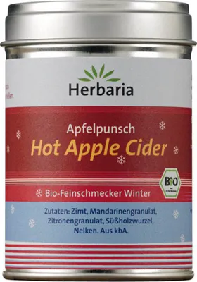 A tin of Herbaria Hot Apple Cider spice mix with a festive winter design.